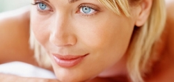 Radiant woman with smooth skin, highlighting facial beauty for implants.