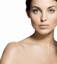 Young woman with flawless skin, embodying natural beauty and elegance.